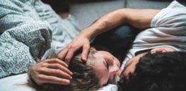 couple intimate bedroom embrace x header x