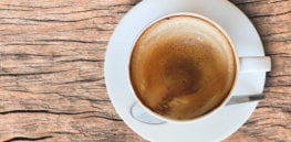 empty coffee cup after drink foam white cup old wooden table
